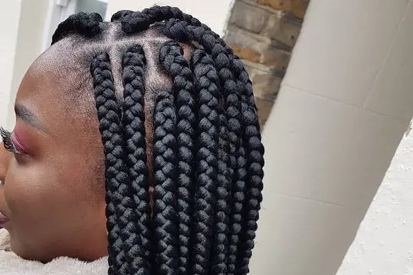 Jumbo cornrow braids for a neat look.