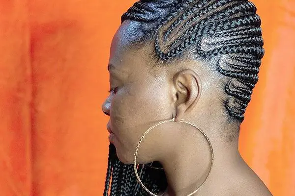 The side Cornrow braids are cool.